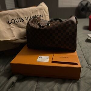 LV speedy 35 NM. Brown with red interior. a red insert for the shape (free).